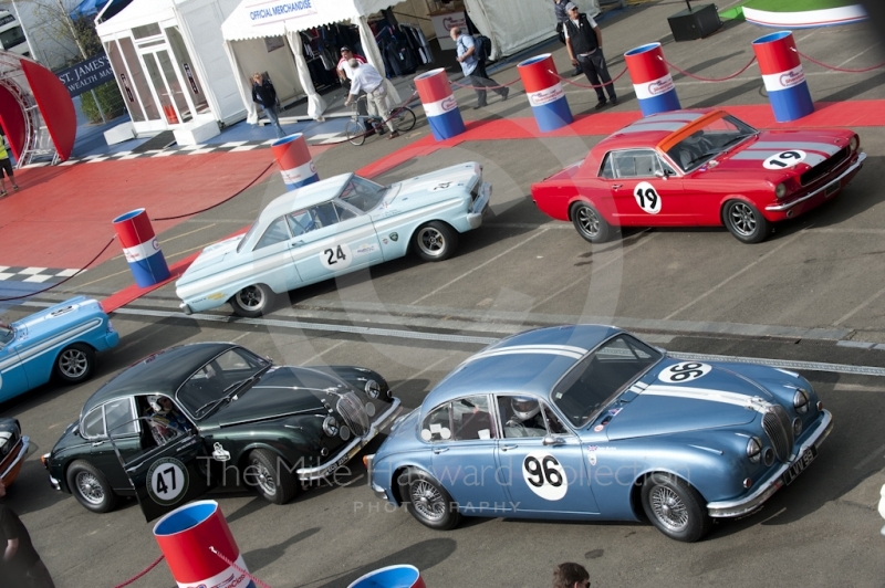 Peter Burton, Jaguar 3.8 Mk2, Christopher Scragg, Jaguar 3.8 Mk2, Harry Wyndham, Ford Falcon, and Chris Chiles, Ford Mustang in the paddock before the HSCC Big Engine Touring race, Silverstone Classic, 2010