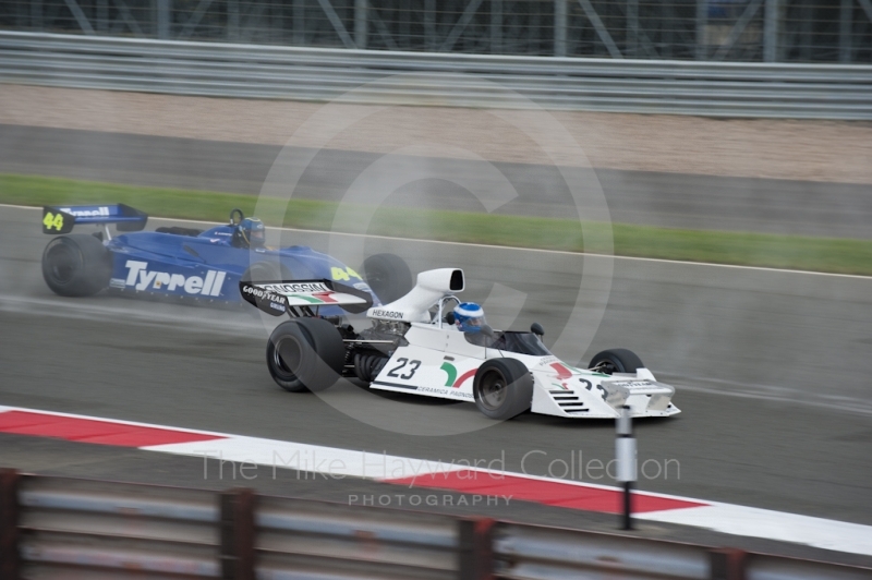 Paul Knapfield, Brabham BT42 and John Wilson, Tyrrell 011, at Woodcote Corner, F1 Grand Prix Masters, Silverstone Classic, 2010