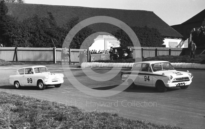 R Swanton, Lotus Cortina, and B Pittard, Ford Anglia, Molyslip Trophy, Mallory Park, 1964.
