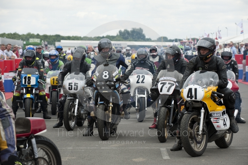 Classic bikes queue in the paddock, Silverstone Classic, 2010