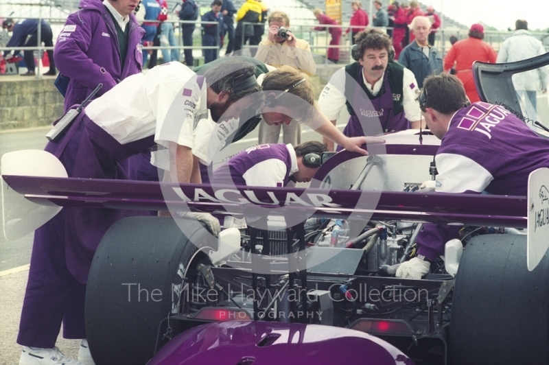 Mechanics working on a Jaguar XJR-11, Shell BDRC Empire Trophy, Round 3 of the World Sports Prototype Championship, Silverstone, 1990.
