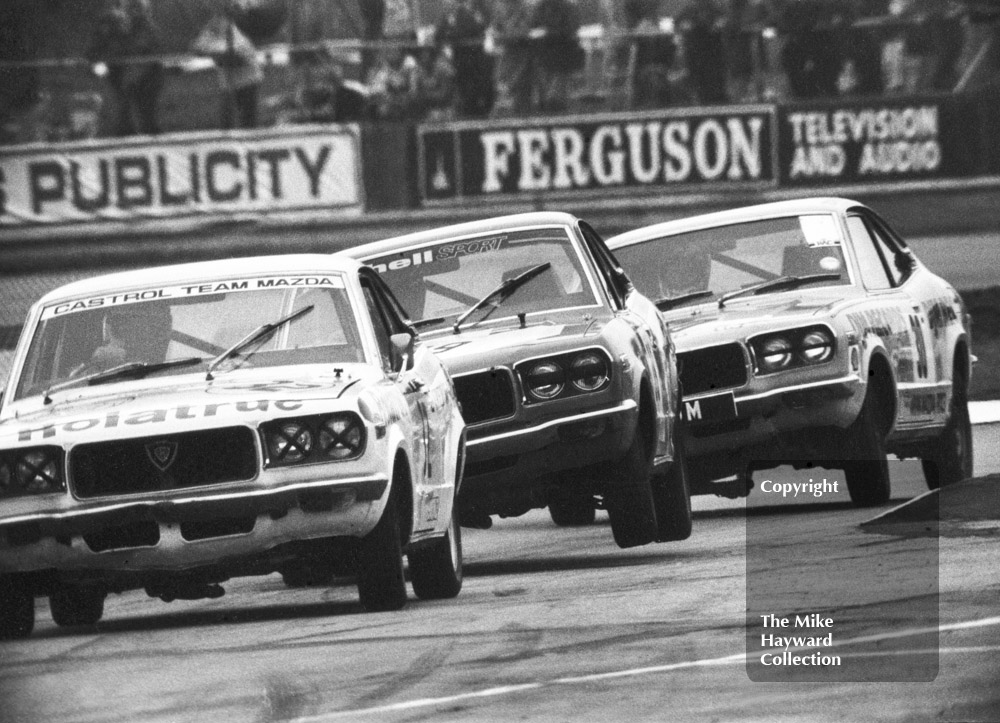 Alan Priest, Jean-Pierre Aux and Tony Lanfranchi, all driving Mazda RX3s, Britax Production Saloon Car Race, European F2 Championship meeting, Silverstone 1975.
