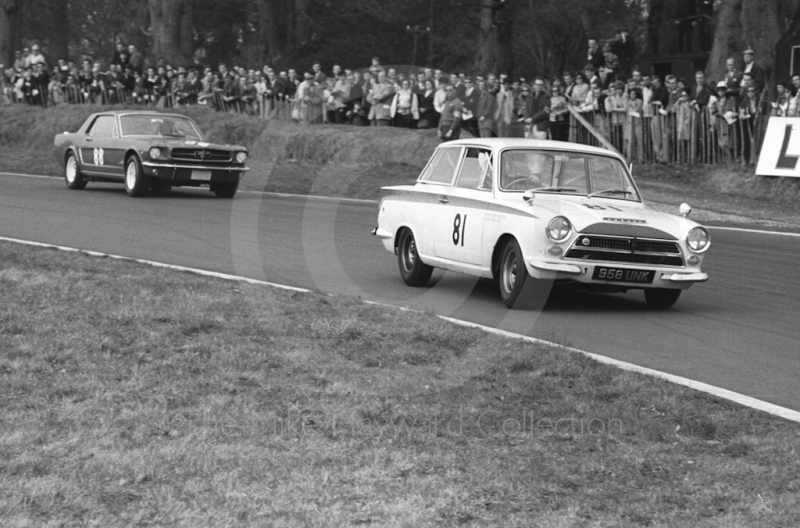 Robin Smith, Curtis Smith Racing Team Lotus Cortina, and Gawaine Baillie, Ford Mustang, at Old Hall Corner, Oulton Park, Spring Race Meeting 1965.
