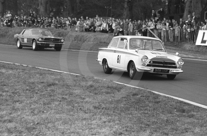 Robin Smith, Curtis Smith Racing Team Lotus Cortina, and Gawaine Baillie, Ford Mustang, at Old Hall Corner, Oulton Park, Spring Race Meeting 1965.
