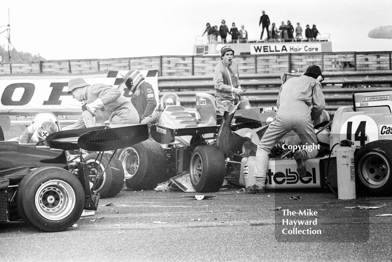 Marshals on the scene helping Alberto Colombo, March 752 BMW, after accident at the chicane, Wella European Formula Two Championship, Thruxton, 1975
