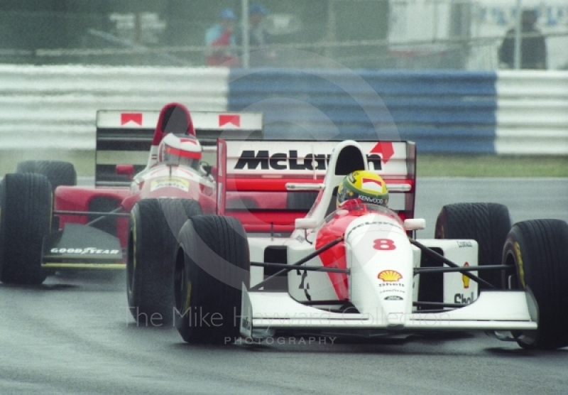 Ayrton Senna, McLaren MP4-8, followed by Gerhard Berger, Ferrari F93A,&nbsp;during wet qualifying at Silverstone for the 1993 British Grand Prix.
