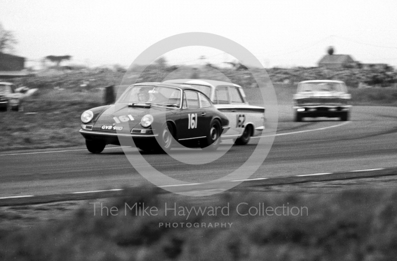 Vic Elford, Porsche 911, and Graham Hill, Lotus Cortina, British Touring Car Championship, Guards 100 meeting, Snetterton, 1967.
