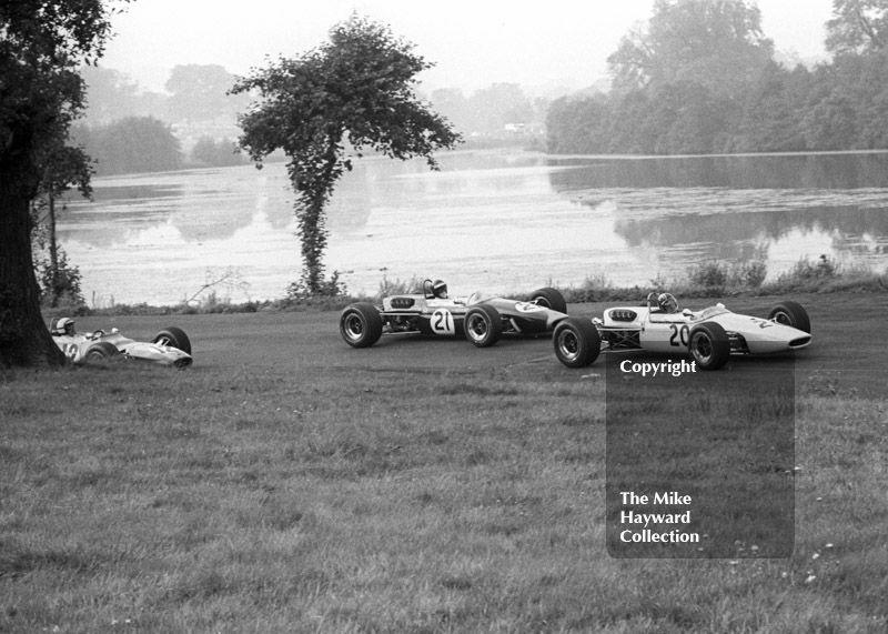 Chris Lambert, McKechnie Racing Brabham BT21/23, leads Jochen Rindt, Winkelmann Brabham BT23, and Brian Redman, David Bridges Lola T100, into Esso Bend, Oulton Park, Guards International Gold Cup, 1967.
