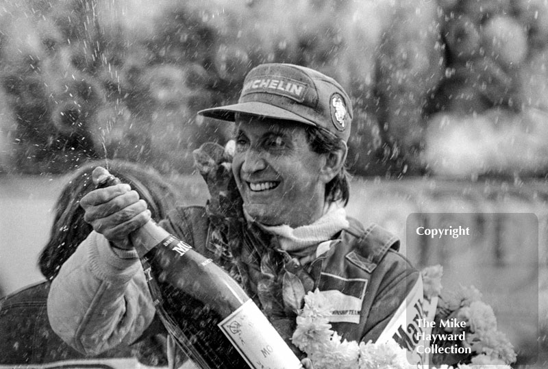 John Watson celebrates winning the 1981 British Grand Prix at Silverstone.
