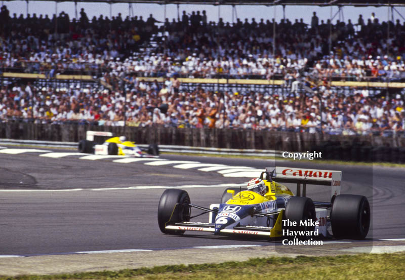 Nelson Piquet and Nigel Mansell, Williams FW11B, at Copse Corner during their battle for the lead, won by Nigel, British Grand Prix, Silverstone, 1987
