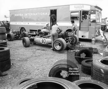 Mechanics working on a Matra 4WD MS84 in the paddock, Silverstone, British Grand Prix 1969.
