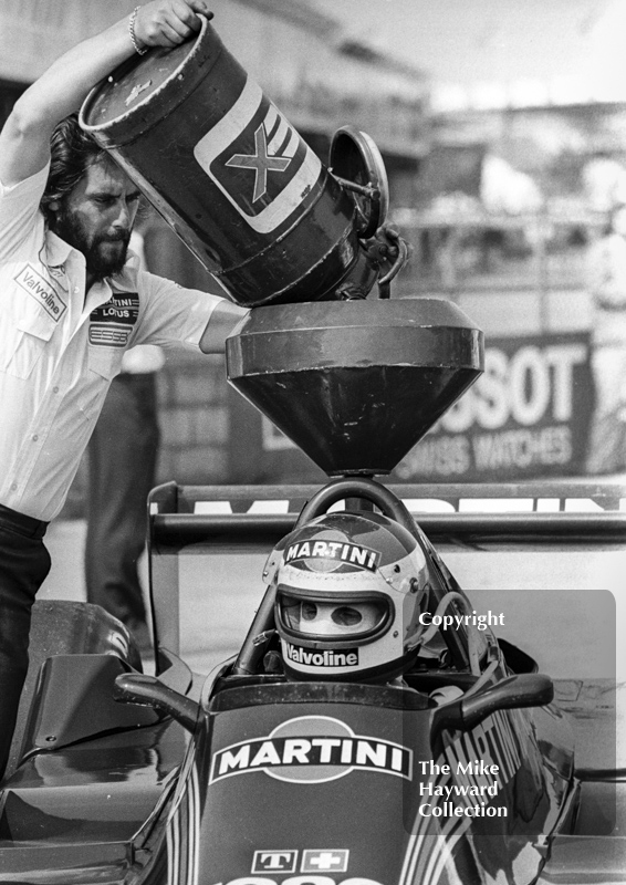 Carlos Reutemann, Martini Lotus 79, gets a top-up, Silverstone, British Grand Prix 1979.
