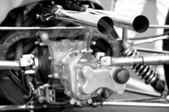 Black and white study of the immaculate rear end of a Lotus 25 F1 before the HGPCA pre-66 Grand prix cars event, Silverstone Classic 2010