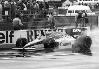 Keke Rosberg, Williams FW10, goes into the pits during practice for the 1985 British Grand Prix at Silverstone.

