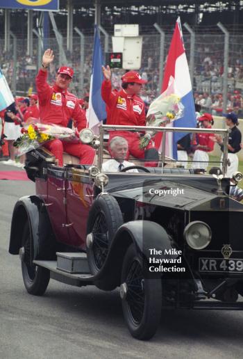 Ferrari team mates Michael Schumacher and Eddie Irvine on parade before the race, Silverstone, British Grand Prix 1996.
