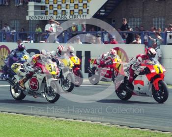 Wayne Rainey, Marlboro Team Roberts Yamaha, leads Kevin Schwantz, Team Lucky Strike Suzuki, off the line, Donington Park, British Grand Prix 1991.