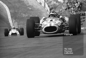 Silvio Moser, Charles Vogele Racing Team Brabham Repco BT20, followed by John Surtees, Honda RA301, at Druids Hairpin, Brands Hatch, 1968 British Grand Prix.

