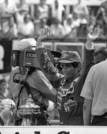 Winner Alain Prost, Renault RE40, acknowledges the crowd, British Grand Prix, Silverstone, 1983
