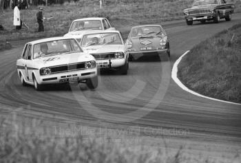 Roger Clark, Team Surtees Lotus Cortina, UVX 565E, leads Jacky Ickx, Team Lotus Cortina, CTC 24E, Vic Elford, Porsche 911, GVB 911D, and Graham Hill, Team Lotus Cortina, CTC 14E, at Cascades Bend, Oulton Park Gold Cup meeting, 1967.
