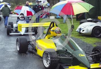 Holding up an umbrella is Martin Baker, OMS S/F, Loton Park Hill Climb, April 2000.