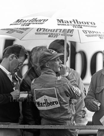 Niki Lauda watches proceedings from the pit wall during qualifying, British Grand Prix, Silverstone, 1985.

