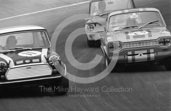 John Rhodes, Mini Cooper S, Alan Peer, Ford Escort GT, and Tony Lanfranchi, Alan Fraser Sunbeam Imp, at South Bank Bend, Brands Hatch, Grand Prix meeting 1968.
