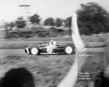 Stirling Moss, Lotus 18, on his victory lap after winning the 1960 Oulton Park Gold Cup.
