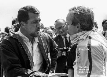 Jo Bonnier, left, chats to John Surtees on the grid at Silverstone before the start of the 1967 British Grand Prix.
