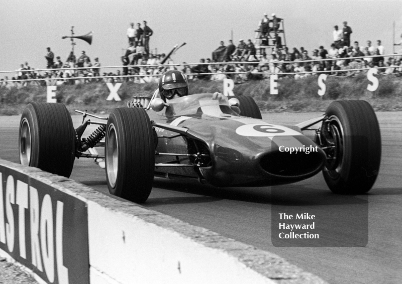 Graham Hill, Lotus Cosworth 49 R3, at Copse Corner, Silverstone, 1967 British Grand Prix.