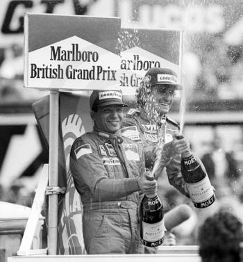 Champagne celebration for runner-up Michele Alboreto and winner Alain Prost, Silverstone, British Grand Prix 1985.
