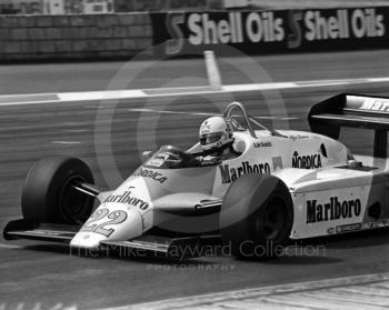 Andrea de Cesaris, Alfa Romeo 182, at Woodcote Corner heading for 8th place, British Grand Prix, Silverstone, 1983
