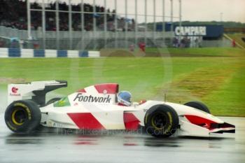 Derek Warwick, Footwork Mugen Honda FA14, seen during wet qualifying at Silverstone for the 1993 British Grand Prix.
