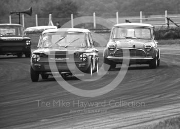 T Watts, Harlton Racing Intercontinental Hillman Imp, leads D Buckett, Mini Cooper S, through Becketts Corner, Silverstone Martini International Trophy 1968.
