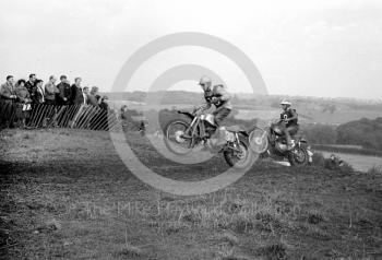 Two airborne riders, motorcycle scramble at Spout Farm, Malinslee, Telford, Shropshire between 1962-1965