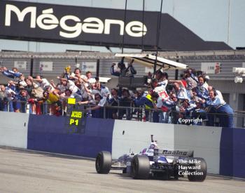 Williams pit crew cheer as Jacques Villeneuve wins with his FW18, Silverstone, British Grand Prix 1996.
