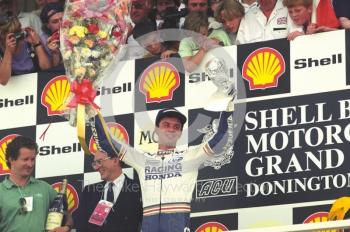 Luca Cadalora celebrates winning the 250cc Grand Prix, Donington Park, British Grand Prix 1991.