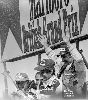 Clay Regazzoni, Williams, Jean-Pierre Jarier, Tyrrell, Rene Arnoux, Renault, on the podium at the 1979 British Grand Prix.
