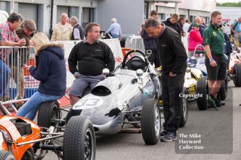 Formula Junior cars lined up in the paddock at the 2016 Silverstone Classic.
