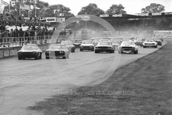 Mick Hill, Ford Boss Capri, and Brian Muir, Wiggins Teape Ford Capri V6, lead at the start, saloon car race, Super Sports 200 meeting, Silverstone, 1972.
