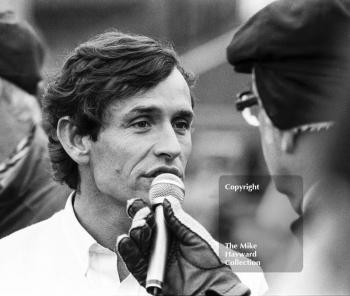 Jacky Ickx, Rothmans Porsche 956, being interviewed by Anthony Marsh on the grid, World Endurance Championship, 1985 Grand Prix International 1000km meeting, Silverstone.
