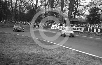 Michael Campbell-Cole, Don Moore 995 Mini Cooper S, leads John Fitzpatrick, Broadspeed Mini Cooper S (BOP 242C), into Old Hall Corner, Oulton Park, Spring Race Meeting 1965.
