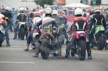 Classic bikes wait to go out on the circuit, Silverstone Classic, 2010