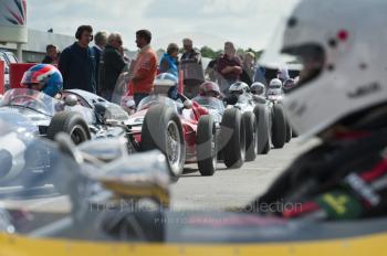 Rear-engined  Formula One machines in the paddock before the HGPCA pre-66 Grand Prix cars event at Silverstone Classic 2010