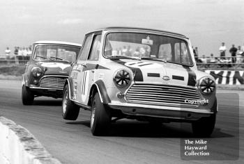 Steve Neal, Britax Cooper Downton Mini Cooper S, leads Barrie Williams, Mini Cooper S, at Copse Corner, Silverstone, British Grand Prix meeting 1969.
