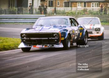 Brian Muir, Wiggins Teape Chevrolet Camaro, followed by John Fitzpatrick in a Broadspeed Ford Escort RS1600, Oulton Park Gold Cup meeting 1971.
