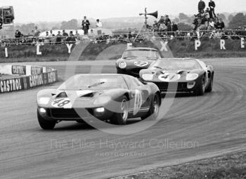 Eric Liddell and Charles Lucas, both in Ford GT40s, and Warren Pearce, Jaguar E type, W D and H O Wills Trophy, Silverstone, 1967 British Grand Prix.
