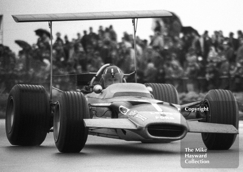 Graham Hill, Gold Leaf Team Lotus Ford 49B, at Copse Corner, Silverstone, International Trophy 1969.