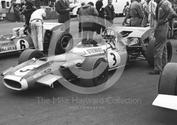 Jackie Stewart's Matra MS80 on the grid with Bruce McLaren in his M7C, Silverstone, 1969 British Grand Prix.
