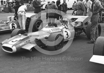 Jackie Stewart's Matra MS80 on the grid with Bruce McLaren in his M7C, Silverstone, 1969 British Grand Prix.
