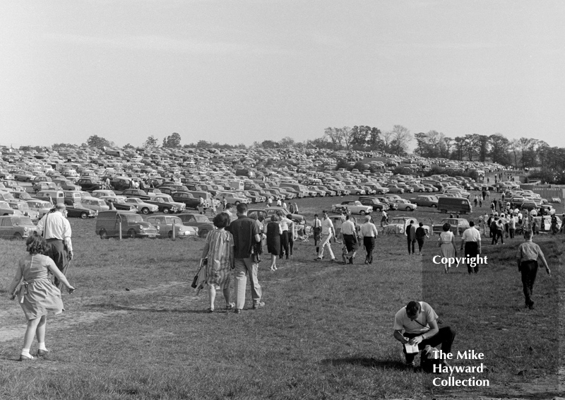 Spectators enjoy the sunshine, Mallory Park, March 1964.